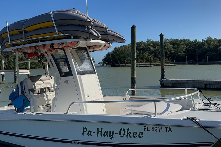 a boat is docked next to a body of water