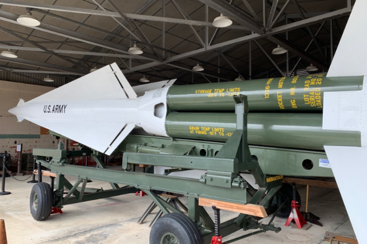 a fighter jet sitting on top of a building