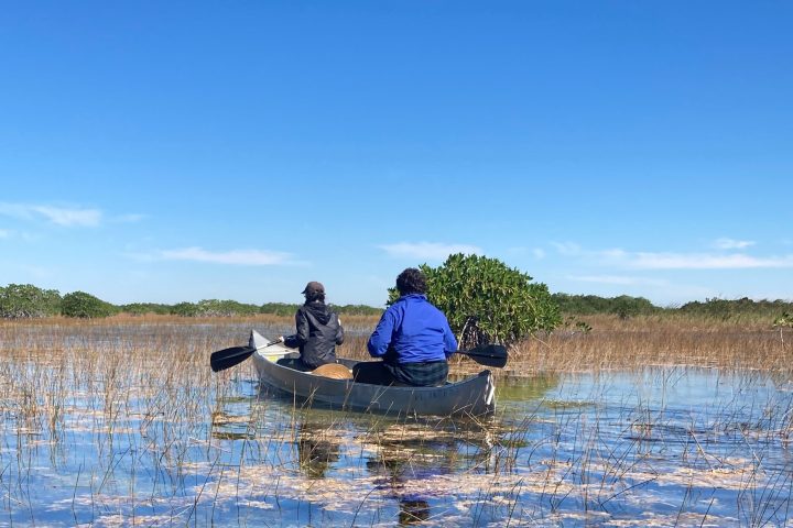a group of people on a raft in a body of water