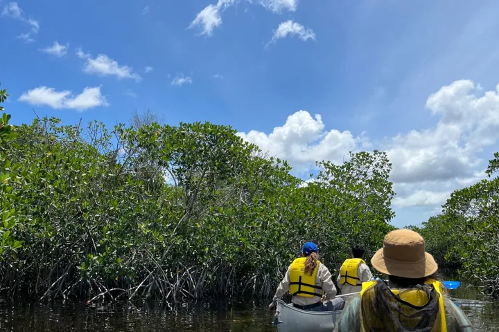 a statue of a man riding on the back of a boat