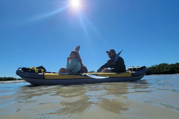 a small boat in a body of water