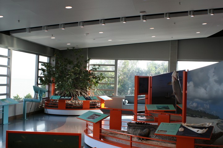 a room filled with furniture and a large window